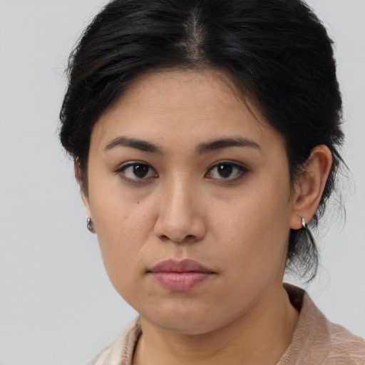 Neutral asian young-adult female with medium  brown hair and brown eyes