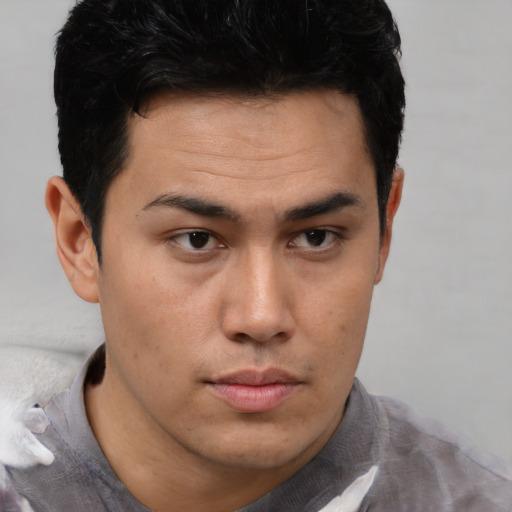 Neutral latino young-adult male with short  brown hair and brown eyes