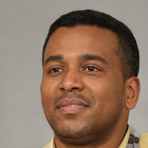 Neutral black adult male with short  black hair and brown eyes