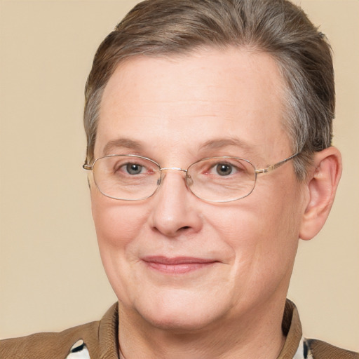 Joyful white adult female with short  brown hair and blue eyes