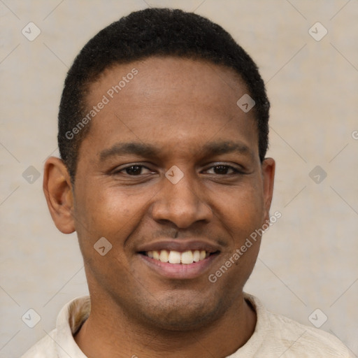 Joyful black young-adult male with short  brown hair and brown eyes