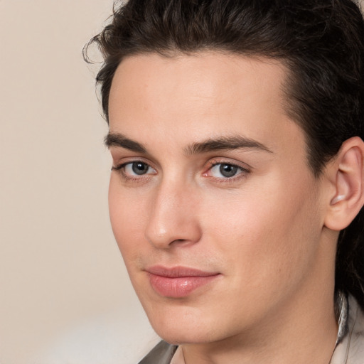 Joyful white young-adult male with medium  brown hair and brown eyes