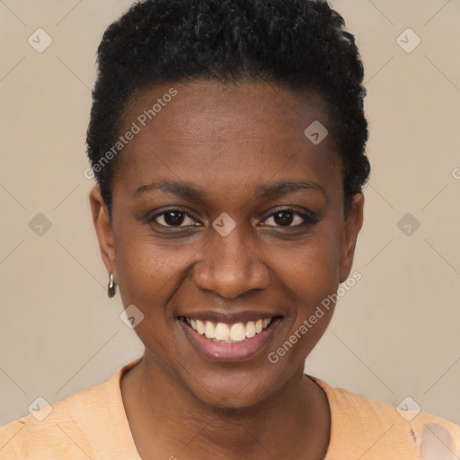 Joyful black young-adult female with short  black hair and brown eyes