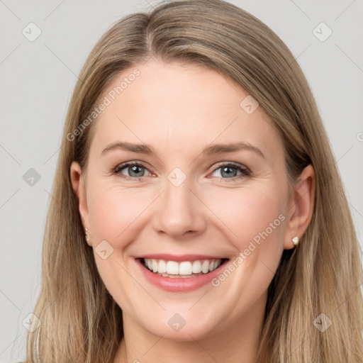 Joyful white young-adult female with long  brown hair and grey eyes