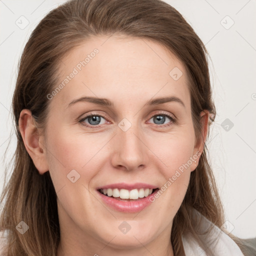 Joyful white young-adult female with long  brown hair and blue eyes