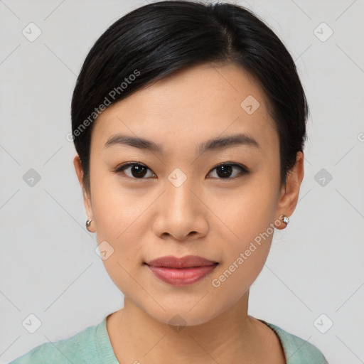 Joyful asian young-adult female with medium  black hair and brown eyes