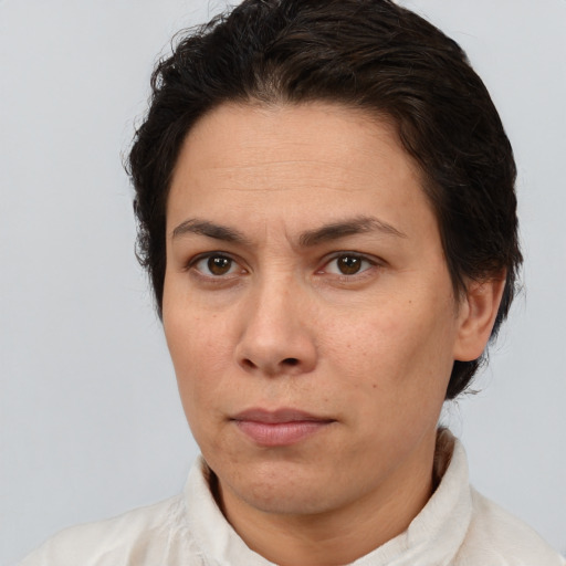 Neutral white adult female with short  brown hair and brown eyes