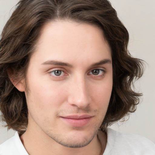 Joyful white young-adult male with medium  brown hair and brown eyes