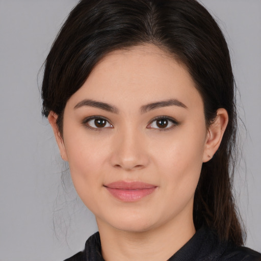 Joyful white young-adult female with medium  brown hair and brown eyes