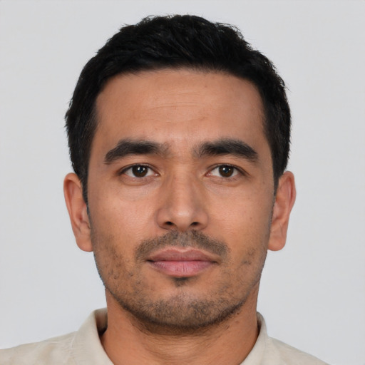Neutral latino young-adult male with short  black hair and brown eyes