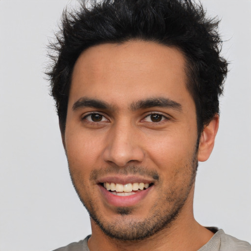 Joyful asian young-adult male with short  black hair and brown eyes