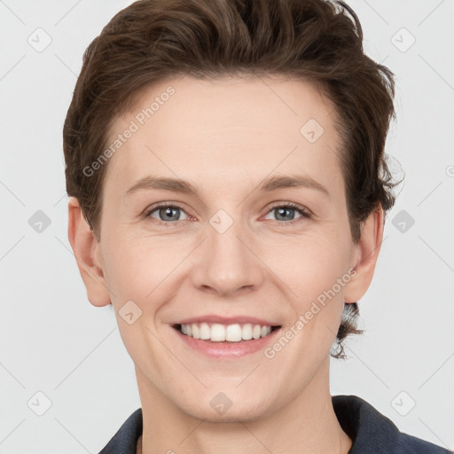 Joyful white young-adult female with short  brown hair and grey eyes