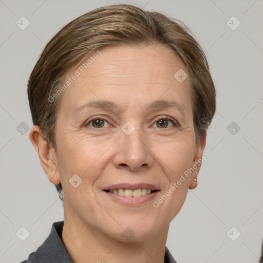 Joyful white adult female with short  brown hair and grey eyes