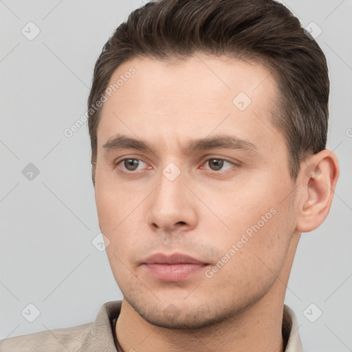 Neutral white young-adult male with short  brown hair and brown eyes