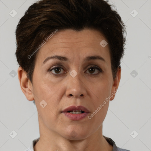 Joyful white adult female with short  brown hair and brown eyes