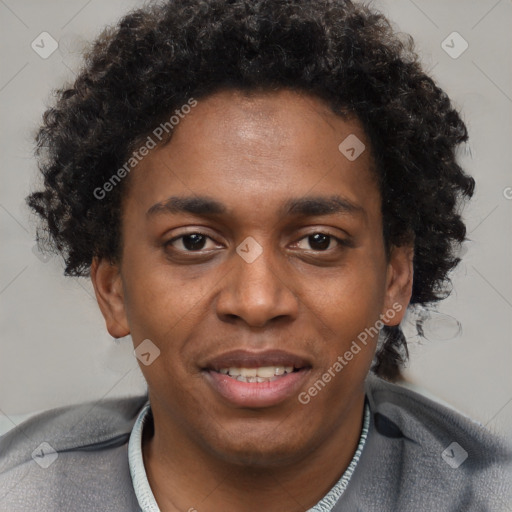 Joyful black young-adult male with short  brown hair and brown eyes