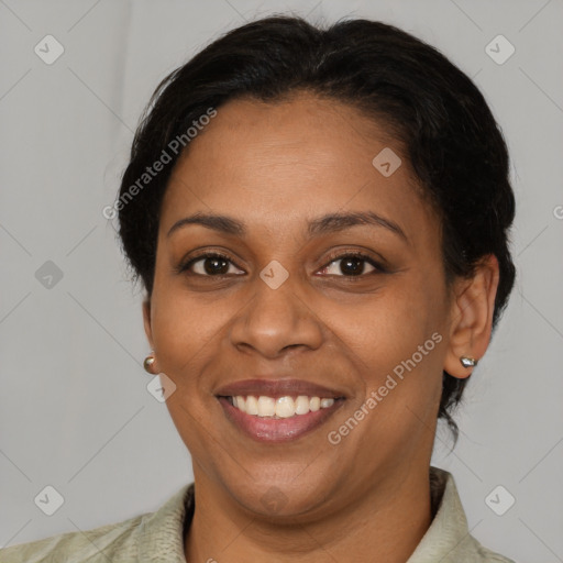 Joyful black adult female with short  brown hair and brown eyes