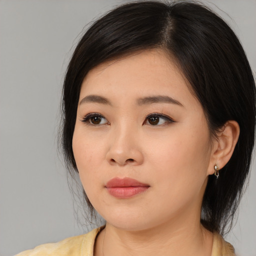 Neutral asian young-adult female with medium  black hair and brown eyes
