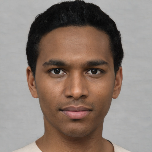 Neutral black young-adult male with short  black hair and brown eyes