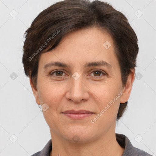 Joyful white adult female with short  brown hair and brown eyes