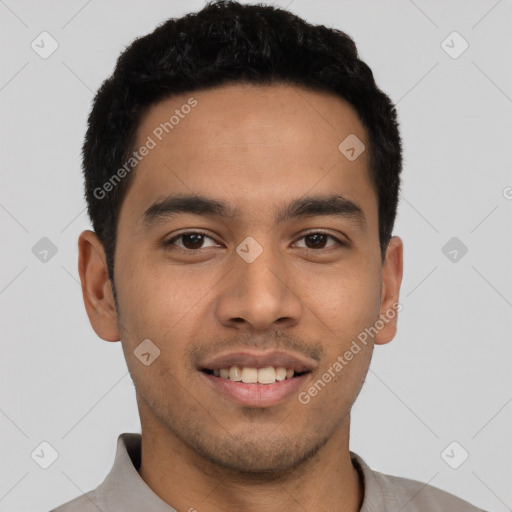 Joyful latino young-adult male with short  black hair and brown eyes