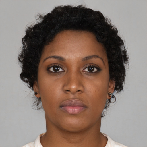 Neutral black young-adult female with short  brown hair and brown eyes