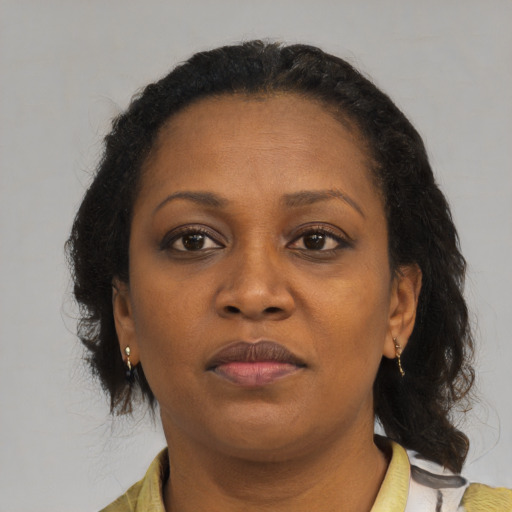 Neutral black adult female with medium  brown hair and brown eyes