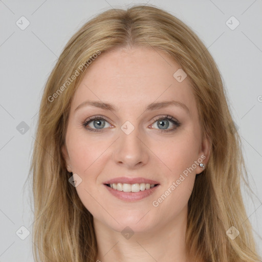 Joyful white young-adult female with long  brown hair and green eyes