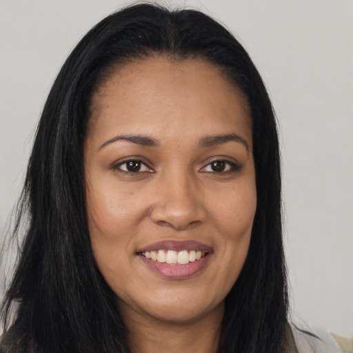 Joyful asian young-adult female with long  brown hair and brown eyes