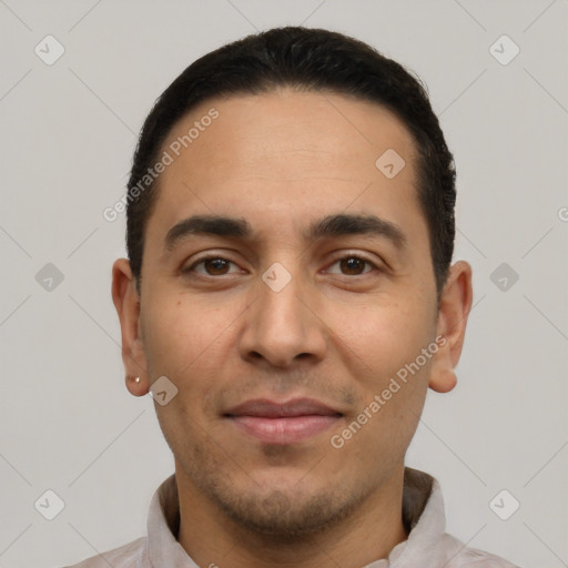 Joyful white young-adult male with short  black hair and brown eyes