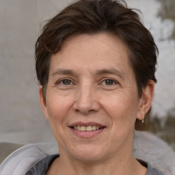 Joyful white adult female with short  brown hair and brown eyes