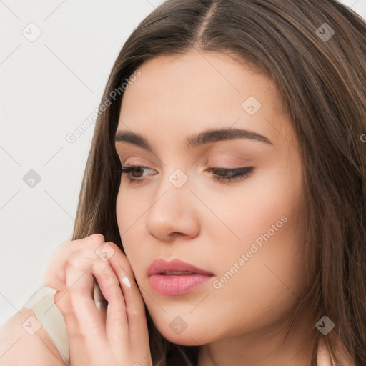 Neutral white young-adult female with long  brown hair and brown eyes