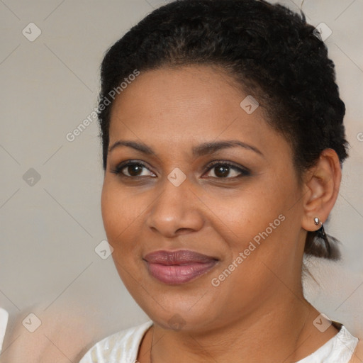 Joyful black young-adult female with short  brown hair and brown eyes