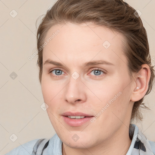 Joyful white young-adult female with medium  brown hair and blue eyes