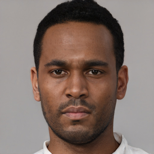 Neutral black young-adult male with short  black hair and brown eyes