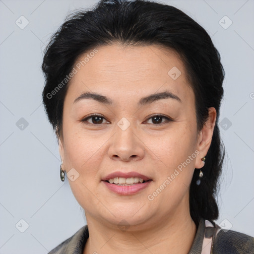 Joyful asian adult female with medium  brown hair and brown eyes