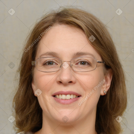 Joyful white adult female with medium  brown hair and blue eyes