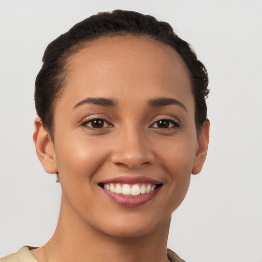 Joyful white young-adult female with short  brown hair and brown eyes