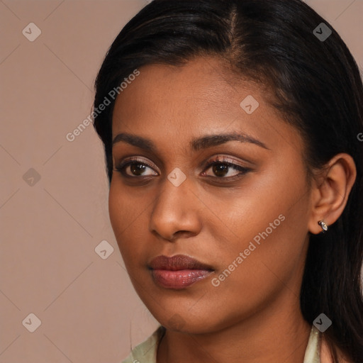 Neutral black young-adult female with long  brown hair and brown eyes