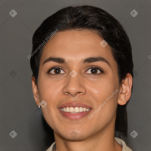 Joyful latino young-adult female with short  brown hair and brown eyes