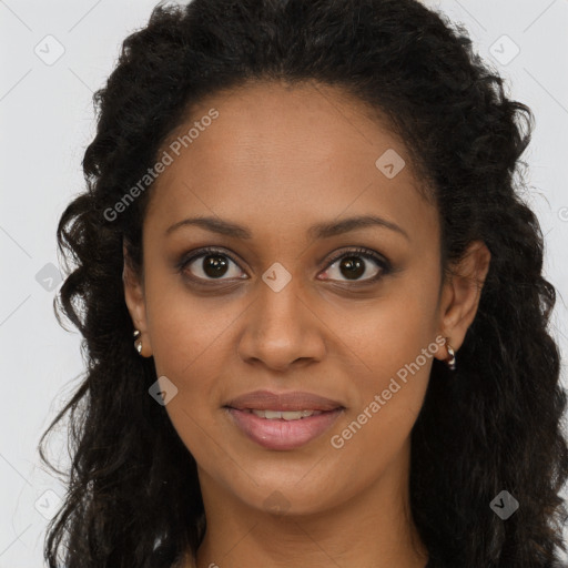 Joyful black young-adult female with long  brown hair and brown eyes