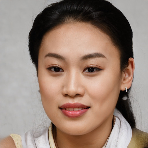 Joyful asian young-adult female with medium  brown hair and brown eyes