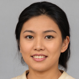 Joyful asian young-adult female with medium  brown hair and brown eyes