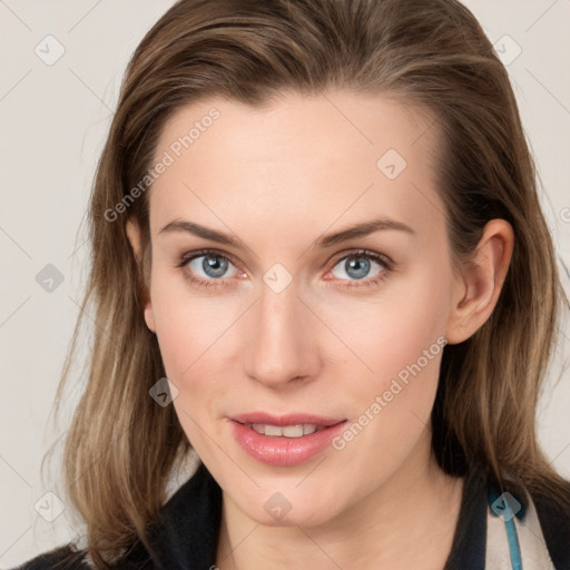 Joyful white young-adult female with long  brown hair and blue eyes