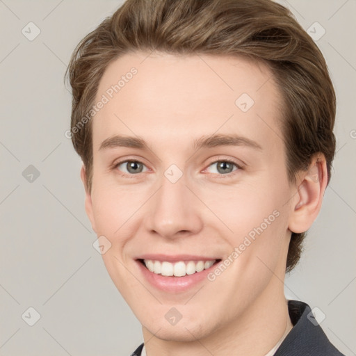 Joyful white young-adult female with short  brown hair and grey eyes