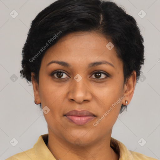 Joyful black adult female with short  brown hair and brown eyes