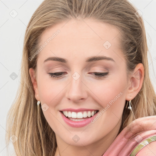 Joyful white young-adult female with medium  brown hair and blue eyes