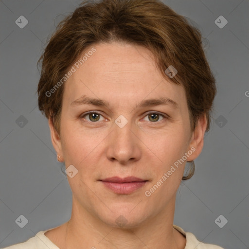 Joyful white adult female with short  brown hair and grey eyes