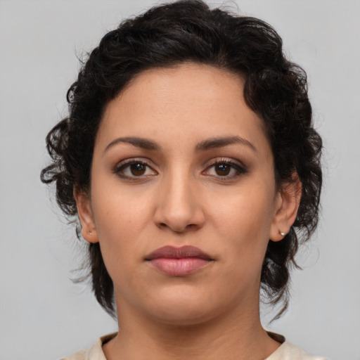 Neutral latino young-adult female with medium  brown hair and brown eyes