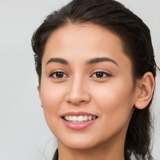 Joyful white young-adult female with long  brown hair and brown eyes